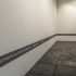 Ana Iti, <i>Does the brick recall Pukeahu?</i>, 2017, text, acrylic, dimensions variable, courtesy of the artist. Installation view, <i>The earth looks upon us / Ko Papatūānuku te matua o te tangata</i>, curated by Christina Barton, Adam Art Gallery Te Pātaka Toi, Victoria University of Wellington