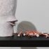 Julia Morison, <i>A mouthful of teeth,</i> 2018, Glazed porcelain, tiger tail, 290 × 150 × 160mm. In <i>Julia Morison: Head[case]</i>, Adam Art Gallery Te Pātaka Toi, Victoria University of Wellington, 2 June – 16 July 2020. Photo: Ted Whitaker
