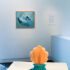 Alexis Hunter (1948–2014), <em>The Lure of the Sea </em>, 1988, oil on canvas, private collection, Auckland; and Megan Dunn, <em>I’ve Heard the Mermaids… </em>, 2022, recorded sound, novelty telephone, collection of Megan Dunn. Installation view of Megan Dunn: The Mermaid Chronicles </em> at Te Pātaka Toi Adam Art Gallery. Photo: Ted Whitaker 